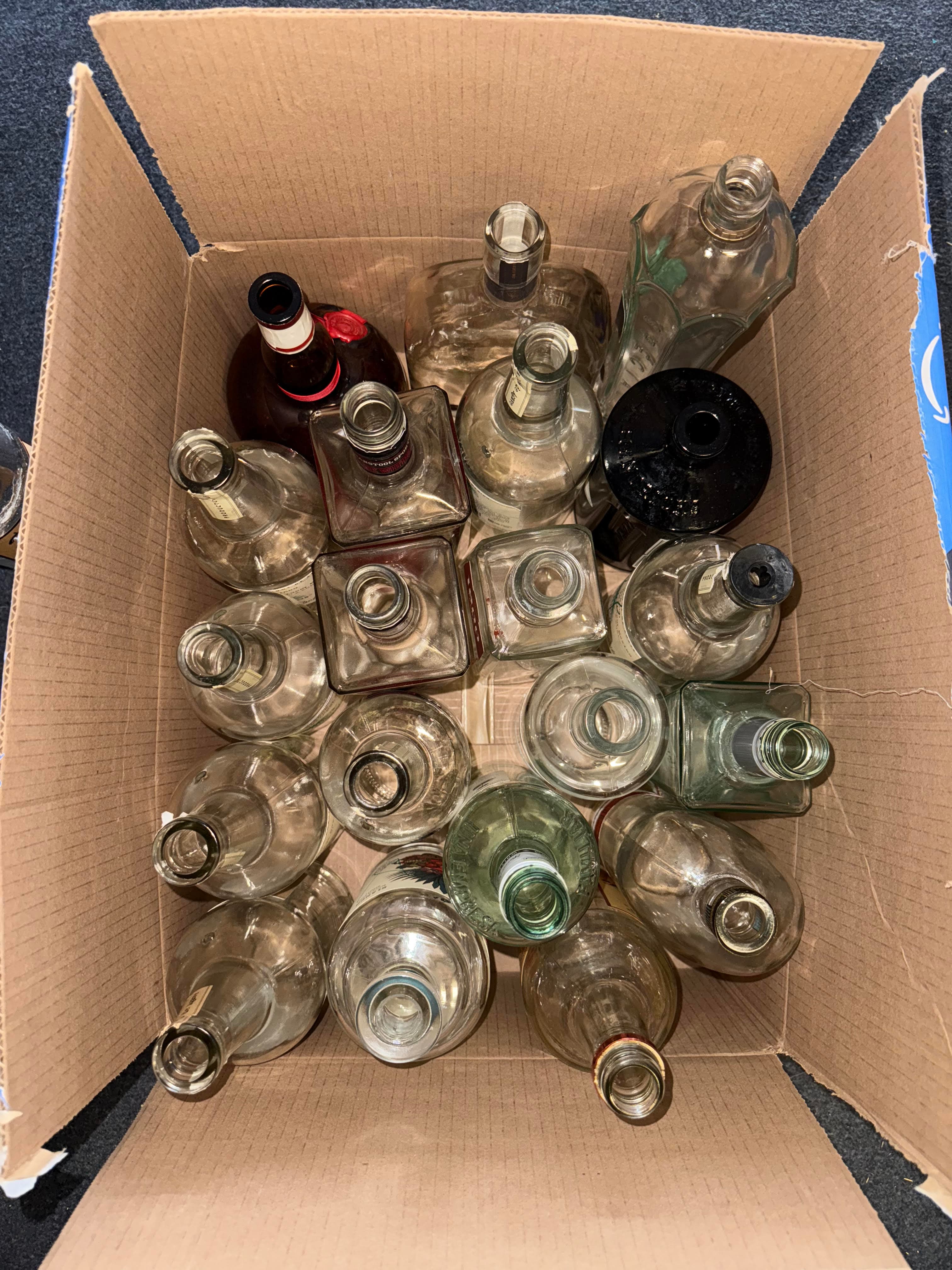 Collection of empty liquor bottles being rescued from local Scottsdale bars